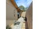 Private outdoor shower with stone pathway and tropical plants at 3350 Crump Rd, Winter Haven, FL 33881