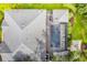 Overhead view showcasing a home with a screened pool and spa at 2931 Chickasaw Cir, Haines City, FL 33844