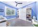 Bedroom with built-in shelves and a Murphy bed at 2931 Chickasaw Cir, Haines City, FL 33844