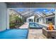 Enjoy the pool and patio from this relaxing hanging bed at 2931 Chickasaw Cir, Haines City, FL 33844