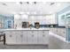 Modern kitchen with white cabinets, marble countertops, and stainless steel appliances at 2931 Chickasaw Cir, Haines City, FL 33844