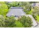 House with a large backyard, screened-in pool, and landscaping at 2931 Chickasaw Cir, Haines City, FL 33844