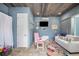 Relaxation room featuring a comfy sofa and rocking chair at 2931 Chickasaw Cir, Haines City, FL 33844
