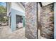 Covered patio with stone wall and view of pool at 2931 Chickasaw Cir, Haines City, FL 33844