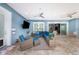 Spacious patio with comfortable seating and a large TV at 2931 Chickasaw Cir, Haines City, FL 33844