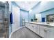 Spa-like bathroom with double vanity, marble countertop and walk-in shower at 2931 Chickasaw Cir, Haines City, FL 33844