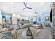 Open living room featuring a spacious sectional sofa and fireplace, with views into the kitchen at 2931 Chickasaw Cir, Haines City, FL 33844
