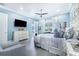 Bright bedroom with king-size bed, dresser, and large window with plantation shutters at 2931 Chickasaw Cir, Haines City, FL 33844