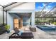 Pool area with sauna and a relaxing lounge chair at 2931 Chickasaw Cir, Haines City, FL 33844