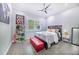 Bright bedroom with gray walls, red bench, and ample natural light at 2931 Chickasaw Cir, Haines City, FL 33844