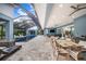 A large table and poolside seating perfect for entertaining at 2931 Chickasaw Cir, Haines City, FL 33844