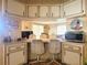Bright kitchen features a breakfast bar and ample cabinetry at 191 Sweet Cir, Winter Haven, FL 33884