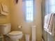 Bathroom with toilet, shower, and ample storage at 191 Sweet Cir, Winter Haven, FL 33884