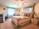 Spacious bedroom with a queen-size bed and built-in workspace at 191 Sweet Cir, Winter Haven, FL 33884