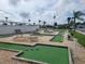 Community mini golf course with benches at 191 Sweet Cir, Winter Haven, FL 33884