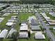 Aerial view of a manufactured home community with pool and clubhouse at 191 Sweet Cir, Winter Haven, FL 33884