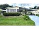 Mobile home with carport and landscaped yard at 191 Sweet Cir, Winter Haven, FL 33884