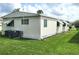 Side view of manufactured home with green lawn at 191 Sweet Cir, Winter Haven, FL 33884
