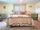 Cozy bedroom with a comfortable bed and decorative pillows at 191 Sweet Cir, Winter Haven, FL 33884