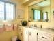Clean bathroom with vanity, mirror, and shower/tub combo at 191 Sweet Cir, Winter Haven, FL 33884