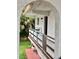 Exterior view of building showing private balcony and landscaping at 1100 Martinique Dr # 208, Winter Haven, FL 33884