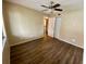 Bright bedroom with ceiling fan and wood-look flooring at 1100 Martinique Dr # 208, Winter Haven, FL 33884