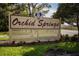 Orchid Springs community entrance sign at 1100 Martinique Dr # 208, Winter Haven, FL 33884