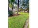 Landscaped grounds featuring a park-like setting with a bench at 1100 Martinique Dr # 208, Winter Haven, FL 33884