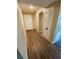 Bright condo entryway with wood-look floors and coat closet at 1100 Martinique Dr # 208, Winter Haven, FL 33884