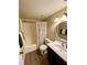 Updated bathroom with tub, toilet, vanity, and a large mirror at 1100 Martinique Dr # 208, Winter Haven, FL 33884