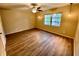 Bright bedroom with wood-look floors and window at 1100 Martinique Dr # 208, Winter Haven, FL 33884