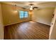 Spacious bedroom with wood-look floors and large window at 1100 Martinique Dr # 208, Winter Haven, FL 33884