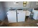 Shared laundry room with two coin-operated washers at 1100 Martinique Dr # 208, Winter Haven, FL 33884