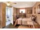 Cozy bedroom with ensuite bathroom and wooden furniture at 512 N 4Th St, Haines City, FL 33844
