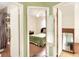 View into bedroom from hallway, showing a bed and bathroom at 512 N 4Th St, Haines City, FL 33844