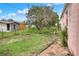 Backyard with a large tree and patchy grass at 512 N 4Th St, Haines City, FL 33844