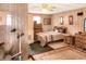 Bedroom with double bed, dresser, and wood paneling at 512 N 4Th St, Haines City, FL 33844