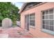 Exterior view of house with sliding glass door and shed at 512 N 4Th St, Haines City, FL 33844