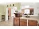 Kitchen with pass-through to dining area and microwave at 512 N 4Th St, Haines City, FL 33844