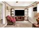 Sunroom with large TV and comfortable seating at 512 N 4Th St, Haines City, FL 33844