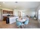 Open concept kitchen with island, dining area, and living room view at 5031 Starboard St, Haines City, FL 33844