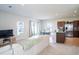 Open living room and kitchen area with neutral colors and modern furniture at 5031 Starboard St, Haines City, FL 33844