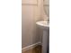 Small half bathroom with pedestal sink at 5031 Starboard St, Haines City, FL 33844