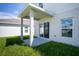 Covered patio with sliding glass doors at 5031 Starboard St, Haines City, FL 33844