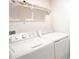 Laundry room with washer, dryer, and shelving at 5031 Starboard St, Haines City, FL 33844