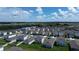 Aerial view of houses and community near a lake at 5031 Starboard St, Haines City, FL 33844