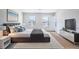 Bright main bedroom with a king-size bed and large TV at 5031 Starboard St, Haines City, FL 33844