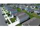 Aerial view of a community with numerous houses and green lawns at 5031 Starboard St, Haines City, FL 33844