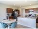 Kitchen with an island, stainless steel appliances, and a dining area at 5031 Starboard St, Haines City, FL 33844