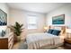 Bedroom with a queen bed and light and airy decor at 5031 Starboard St, Haines City, FL 33844